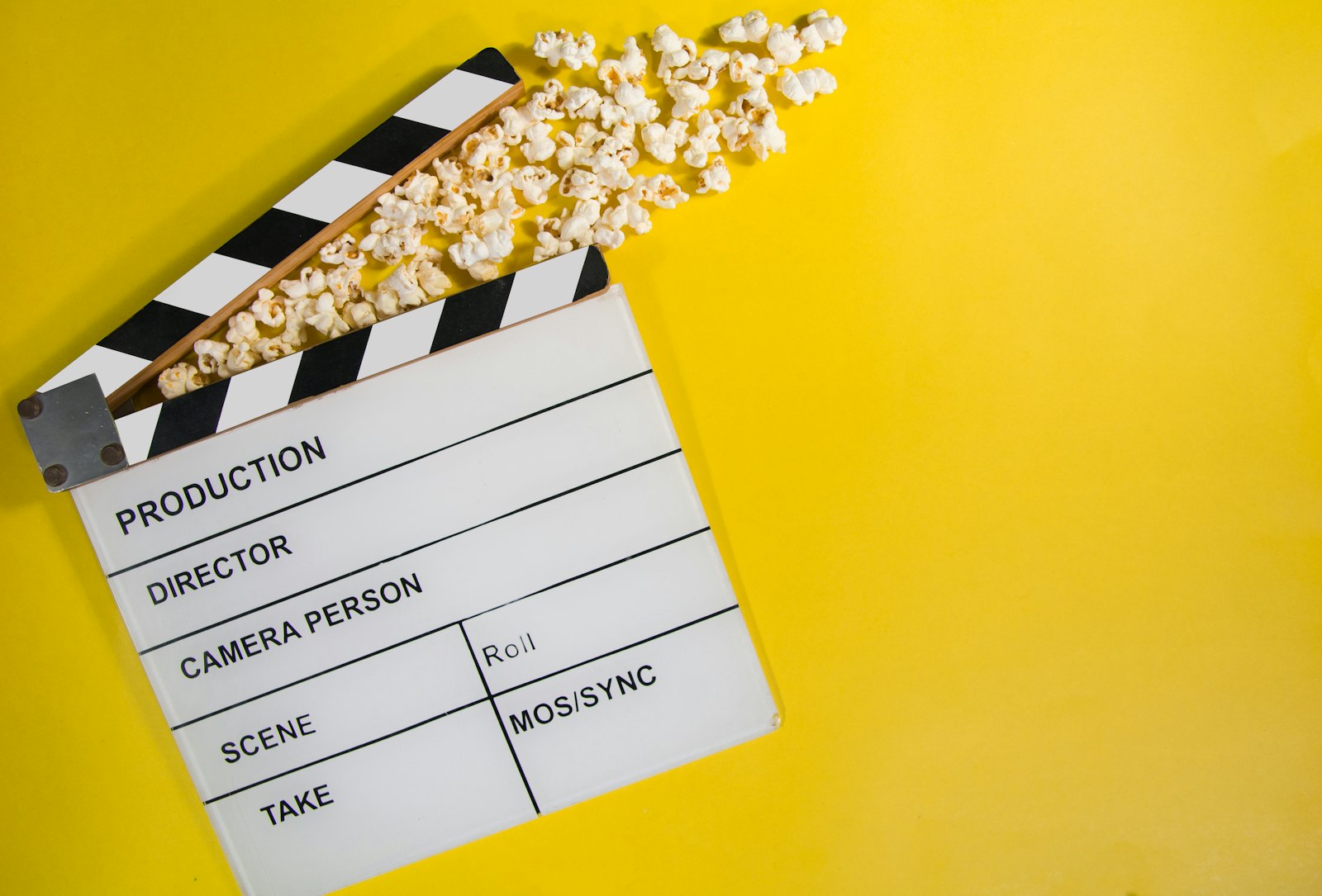 Clapperboard and popcorn representing social and entertainment video