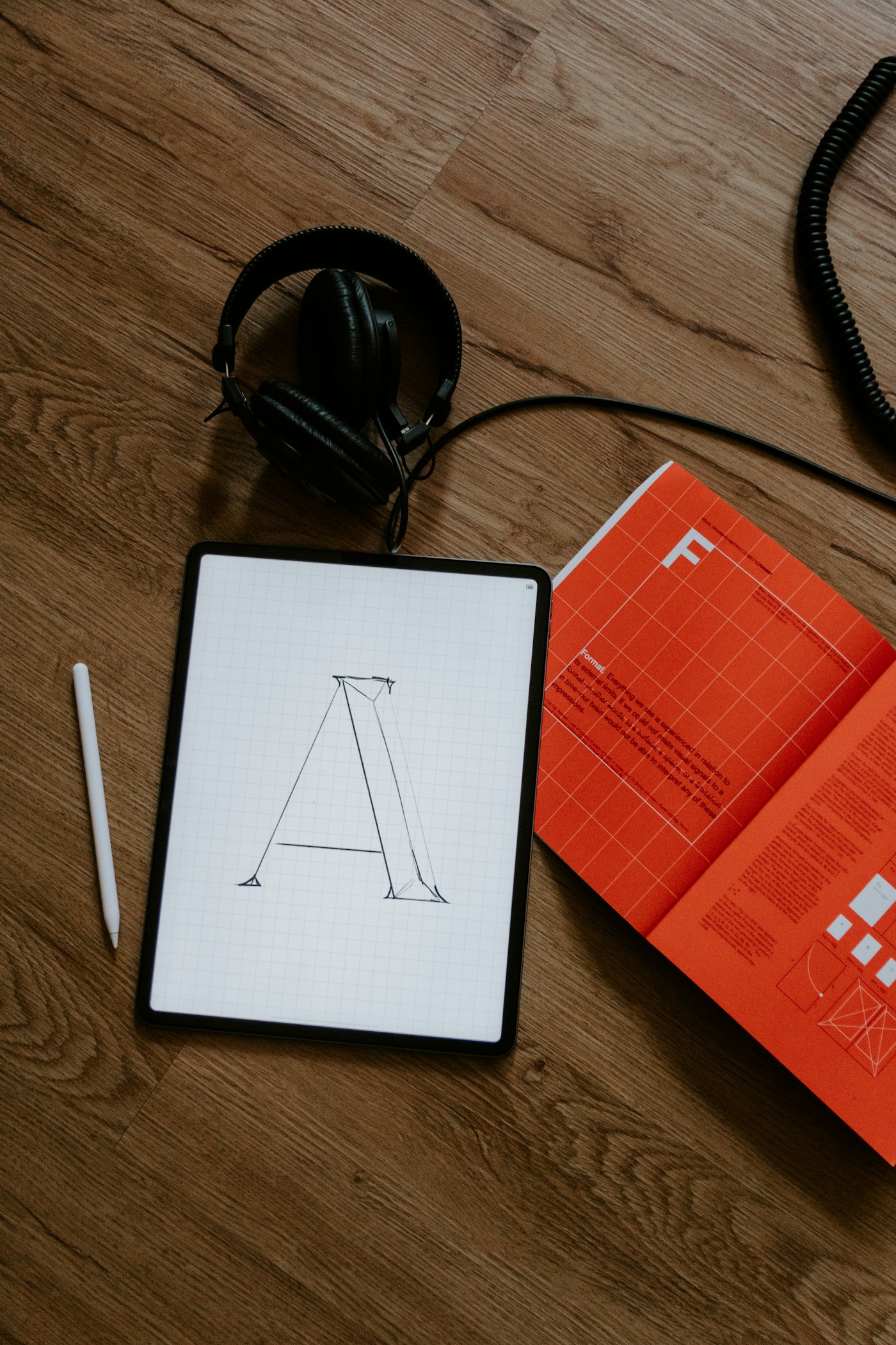 Custom typography and letterform design on a tablet