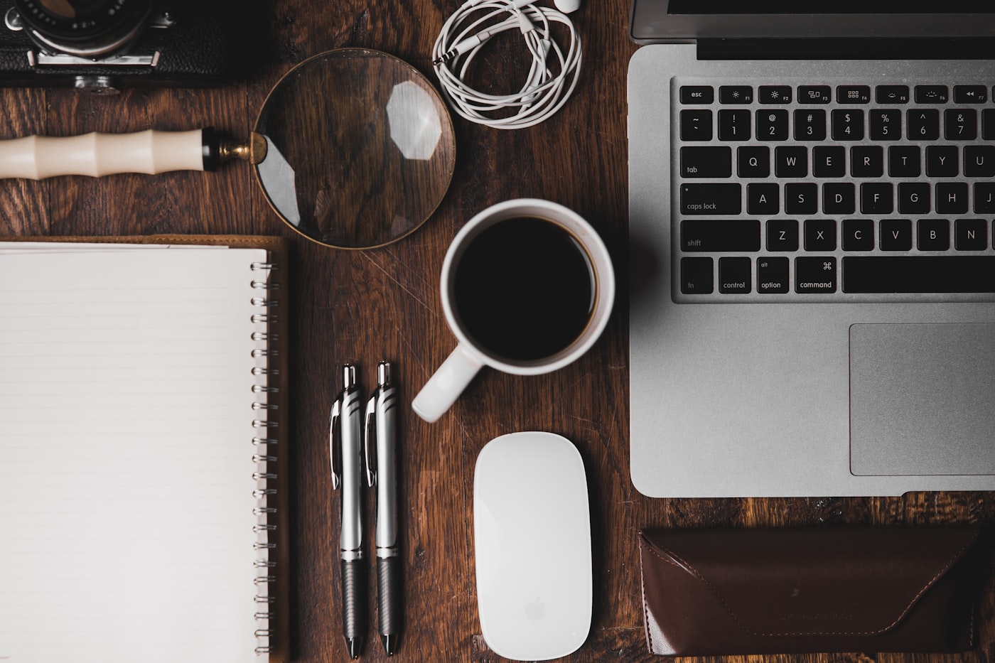 Creative design workspace flat lay with laptop and design tools